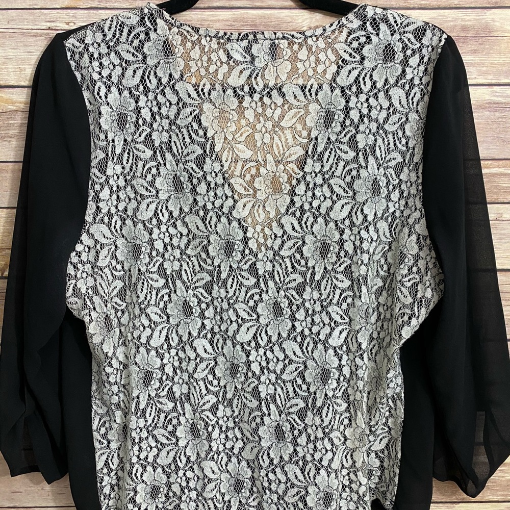 Black sheer with white lace back.